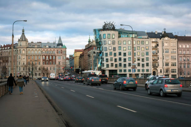 Prague, Czech Republic - January 28, 2019: Famous dancing building, photo taken from nearby bridge, in Prague.