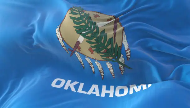 Flag of american state of Oklahoma, region of the United States, waving at wind