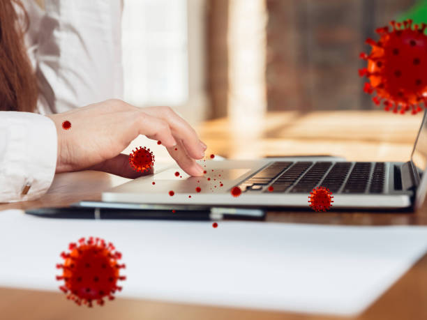 istock Viruses on your gadget, keyboard using daily - concept of spreading of virus, 3D model illustration 1218612837