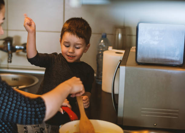 istock Family Cooking Together at Kitchen 1218615417