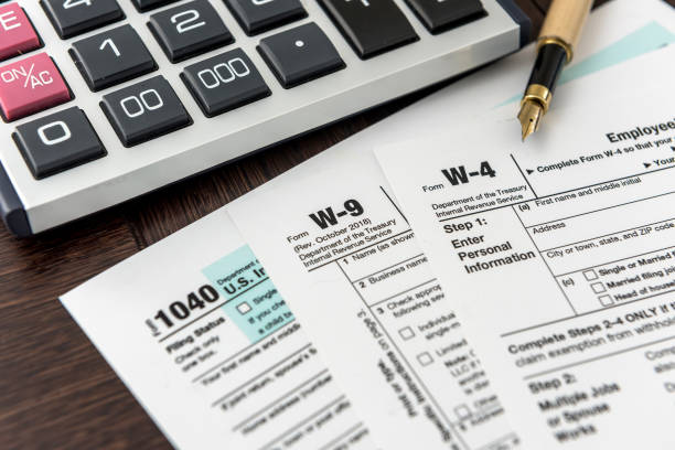 istock Tax Forms with Calculator and Pen. Financial accounting 1218615567