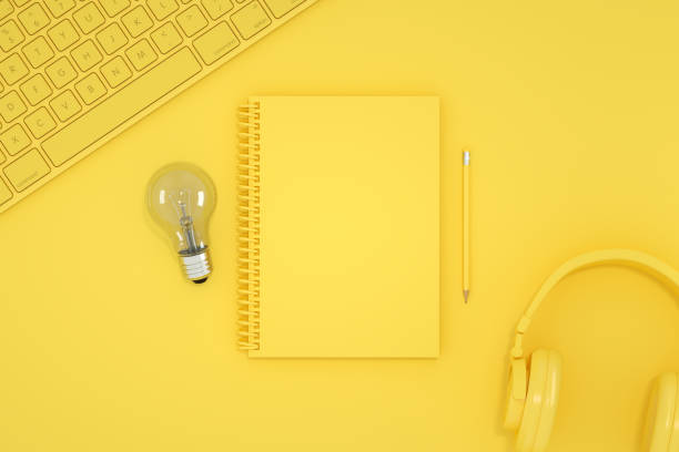 Top view of empty notebook with light bulb, new idea, brainstorming concept.