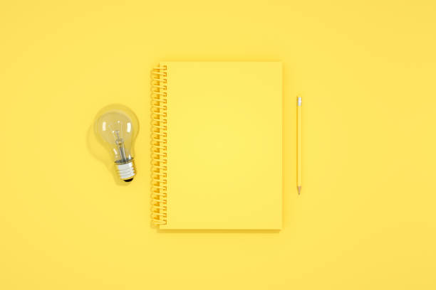 istock Top view of empty notebook with light bulb, new idea, brainstorming concept. 1218616215