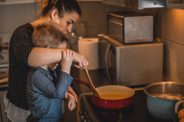 istock Family Cooking Together at Kitchen 1218616679
