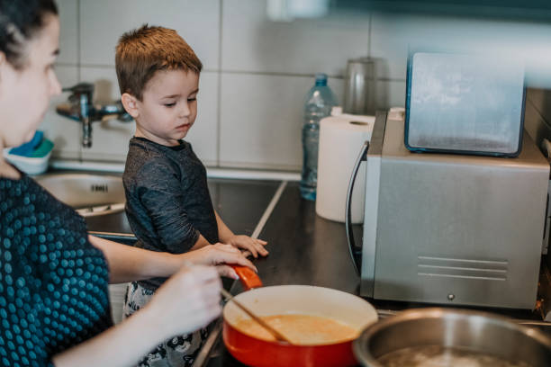 istock Family Cooking Together at Kitchen 1218617771