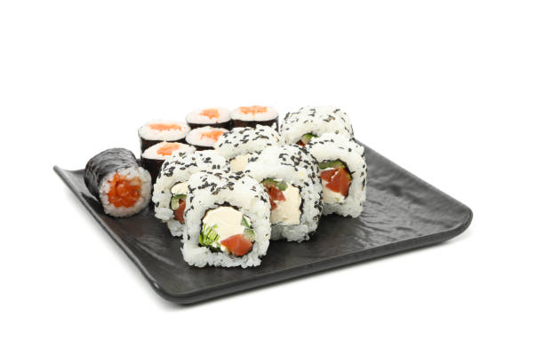 istock Tray with delicious sushi rolls isolated on white background 1218618210