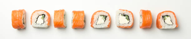 istock Flat lay with sushi rolls on white background. Japanese food 1218618762