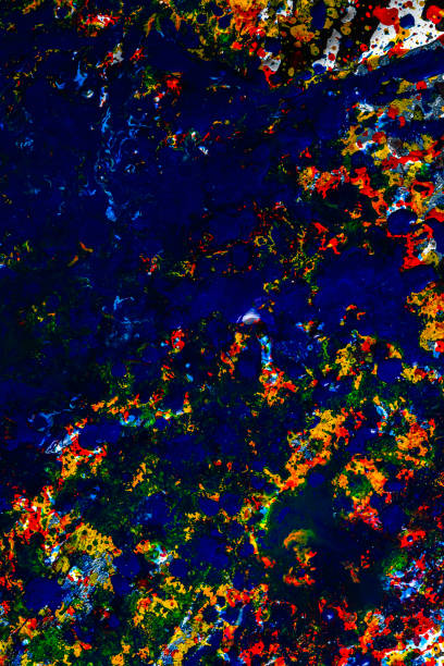 istock background graphic image. dripping. expression. multicolored color spill blemish. mixing colors. Phantom Blue black white red yellow. Vertical orientation. flat lay. 1218619149