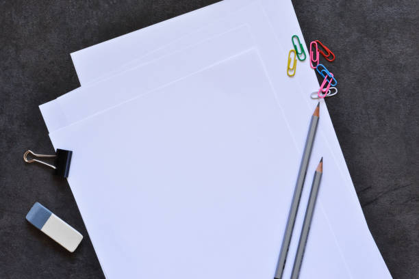 istock Office set: white sheets of paper, pen, pencil. 1218620491