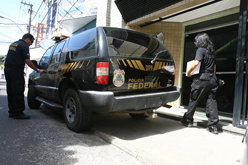 ilheus, bahia / brazil - august 2, 2011: Federal Police agents during the execution of search warrant and seizure in a medical clinic of the city of Ilheus, during operation \