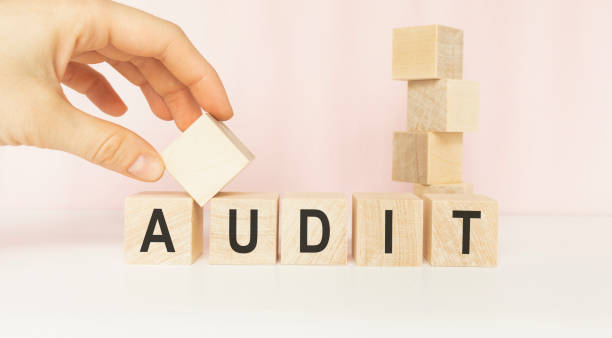 istock Word AUDIT on wooden cubes on white background 1218621894