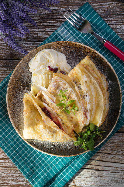 istock Crepes with ricotta cheese and blackcurrant jam. 1218622268