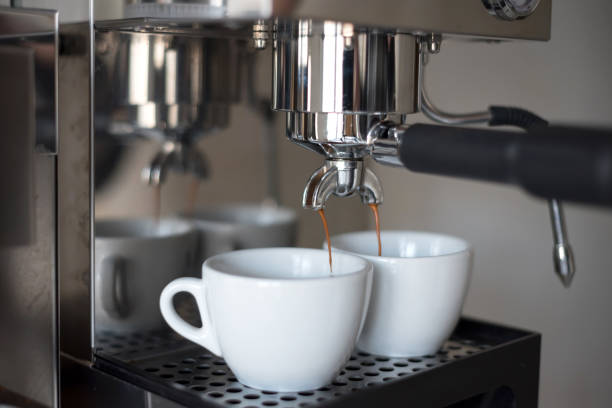istock Preparing two cups of coffee on an espresso machine. 1218626197