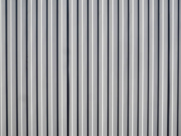 istock Grey metal sheet with vertical stamping, background. 1218626606