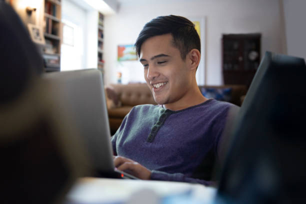 Teenager student working from home stock photo