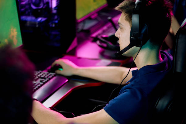 istock Boy playing video game in computer club 1218628552