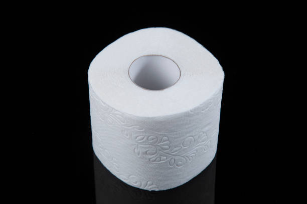 istock Toilet paper is white on a black background 1218628596