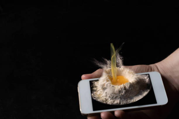 istock An egg fell on the screen of a smartphone with splashes . 1218633767