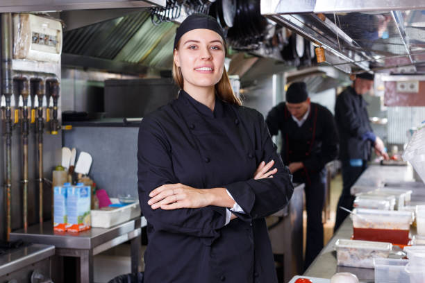 istock Friendly cooks in process of cooking dishes 1218633850