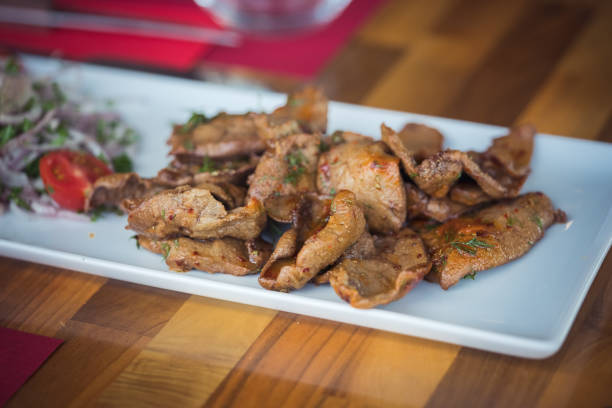 istock Slice of well cooked beef on plate 1218634875