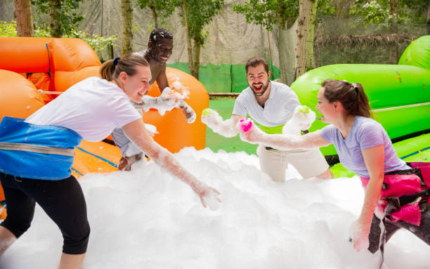 istock Team collecting balls in inflatable foam pool 1218635175