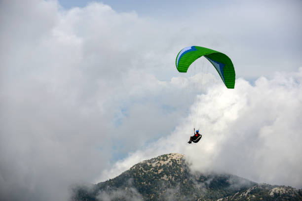 istock Paragliding in cloudy weather. 1218636044