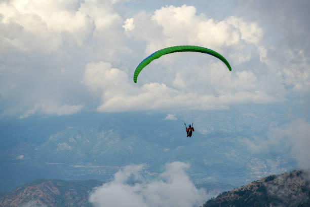 istock Paragliding in cloudy weather. 1218636345