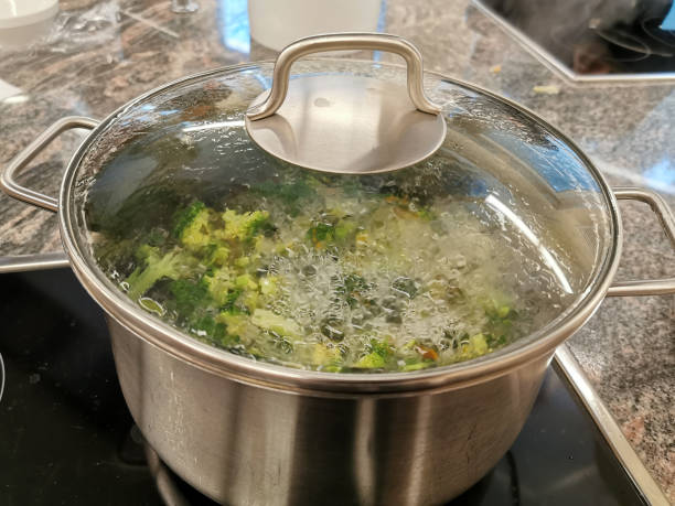 istock Broccoli soup is cooked on a stove, brought to a boil 1218637720