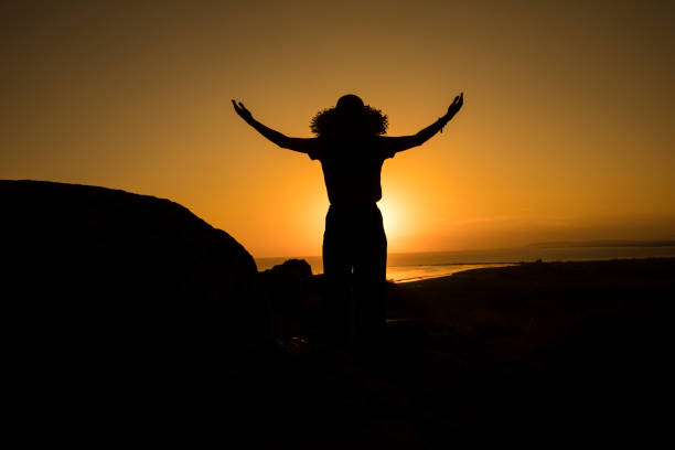 istock tourist woman hat silhouette 1218640681