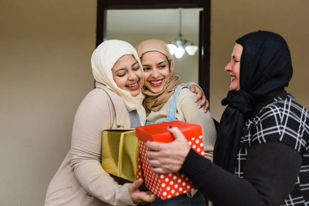 istock Happy Muslim women with gift boxes 1218640807