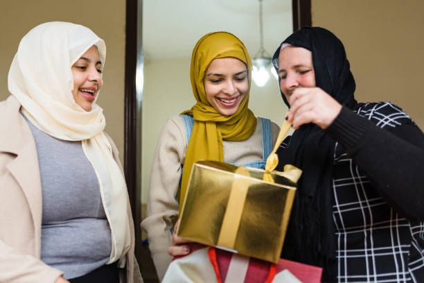 istock Happy Muslim women with gift boxes 1218640943