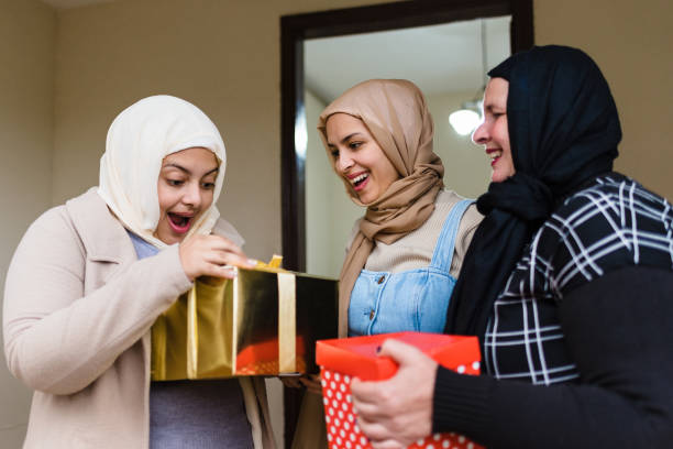 istock Happy Muslim women with gift boxes 1218640944