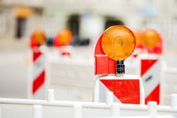 istock Construction site lock with signal lamp on a road. 1218643866