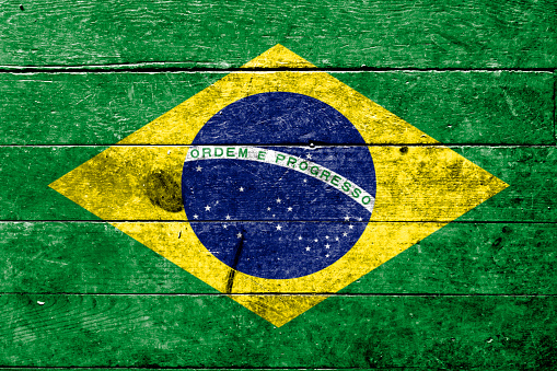 Brazil flag wave close up. Full page Brazil flying flag. Highly detailed realistic 3D rendering.
