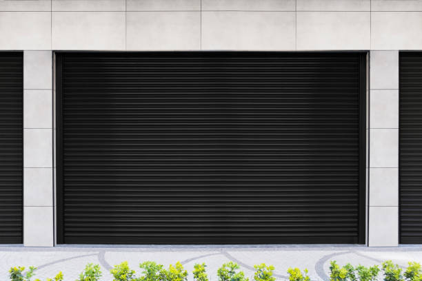 istock Closed Shops black metal roller shutter door. 1218646545