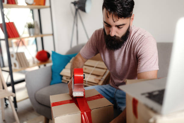 istock Man selling online from his home 1218647356
