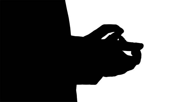 istock Silhouette Caucasian man's hands using sanitizer 1218647473