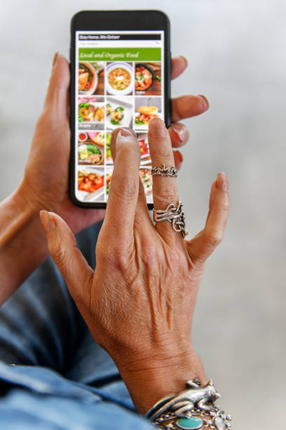 istock Mature woman ordering food online 1218654768