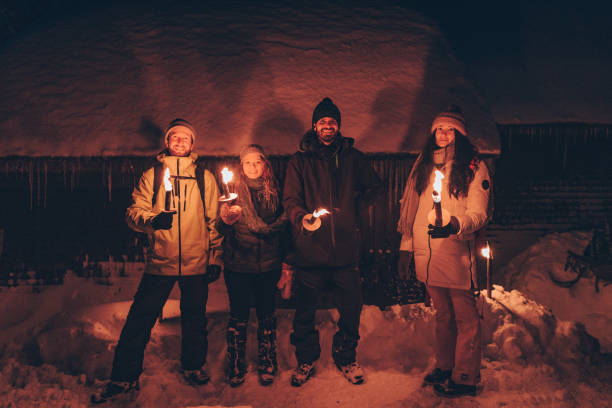 istock Friends hike through snow to log cabin at night 1218654956