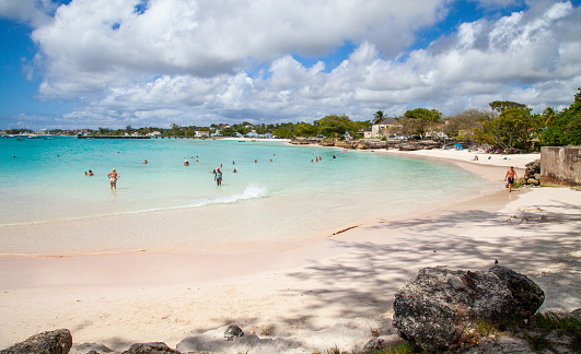 People enjoying the beach at Oistins on a warm sunny day in Barbados