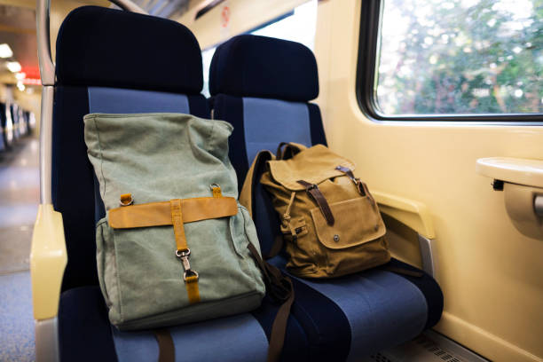 istock Two lone bags sitting on the passenger seat in empty closed wagon 1218657022