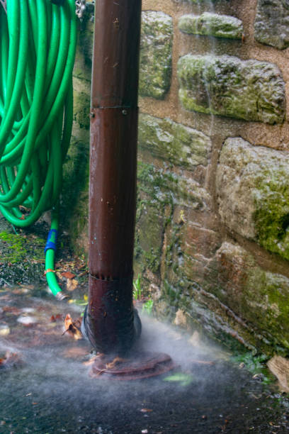 istock Water Flowing Into a Drain During a Rain Storm 1218657218