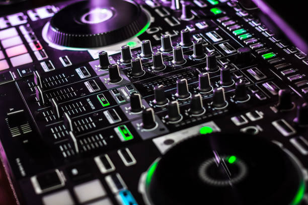 istock Pro DJ Controller Mixer Close-up Recording Equipment illuminated controls 1218659081