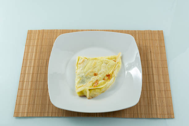 eating homemade omelette