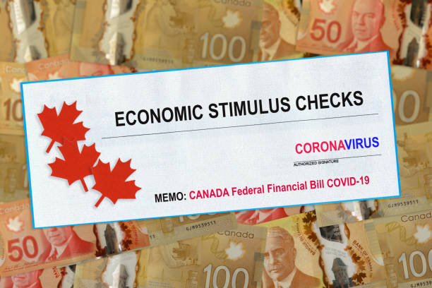 istock Canada doubles value of coronavirus stimulus economic response plan Canadian flags canadian dollar bills on background 1218664327