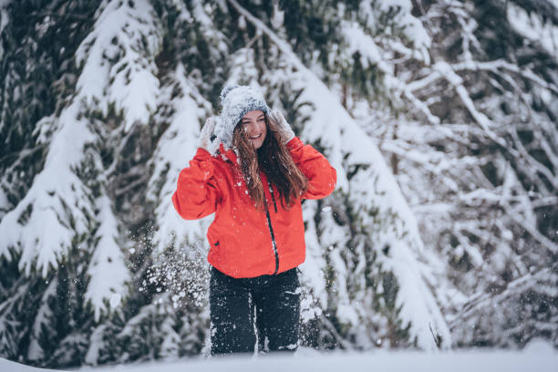 istock Young woman relaxes in snowy forest 1218664958