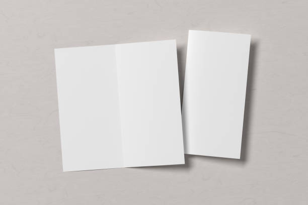 istock Blank bi-fold square leaflet cover. Bi-fold or half-fold opened and folded brochure isolated with clipping path. 1218665213