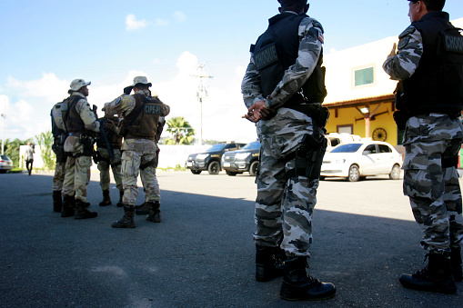 salvador, bahia / brazil - July 14, 2011: Task force formed by Policias Militares es Civis is seen in search of bank robbery suspects in the city of Salvador.