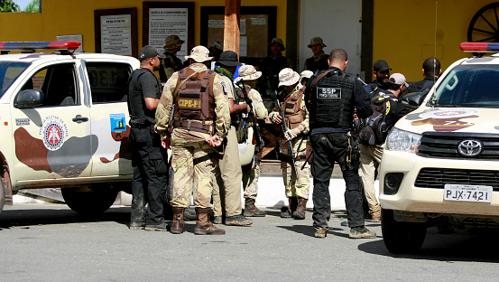 salvador, bahia / brazil - July 14, 2011: Task force formed by Policias Militares es Civis is seen in search of bank robbery suspects in the city of Salvador.