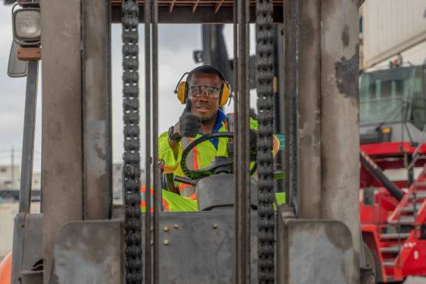 istock industial background of african american forklift driver driving forklift a loading area at containers yard and cargo 1218676339